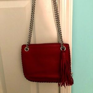 Cherry red, pebbled leather Michael Kors purse.